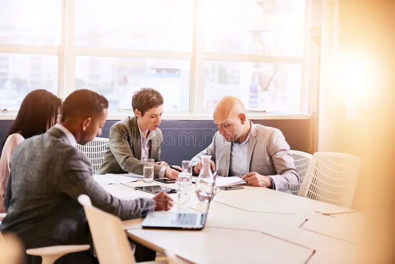 Business executives in a meeting about ISO certification